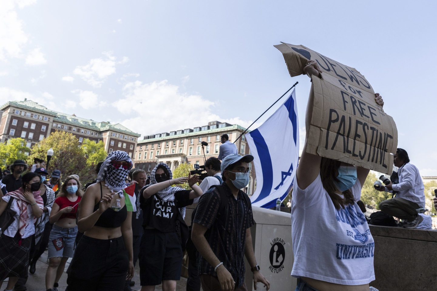 Student protesters march round their encampment on the Columbia University campus, Monday, April 29, 2024, in New York. (AP Photo/Stefan Jeremiah)