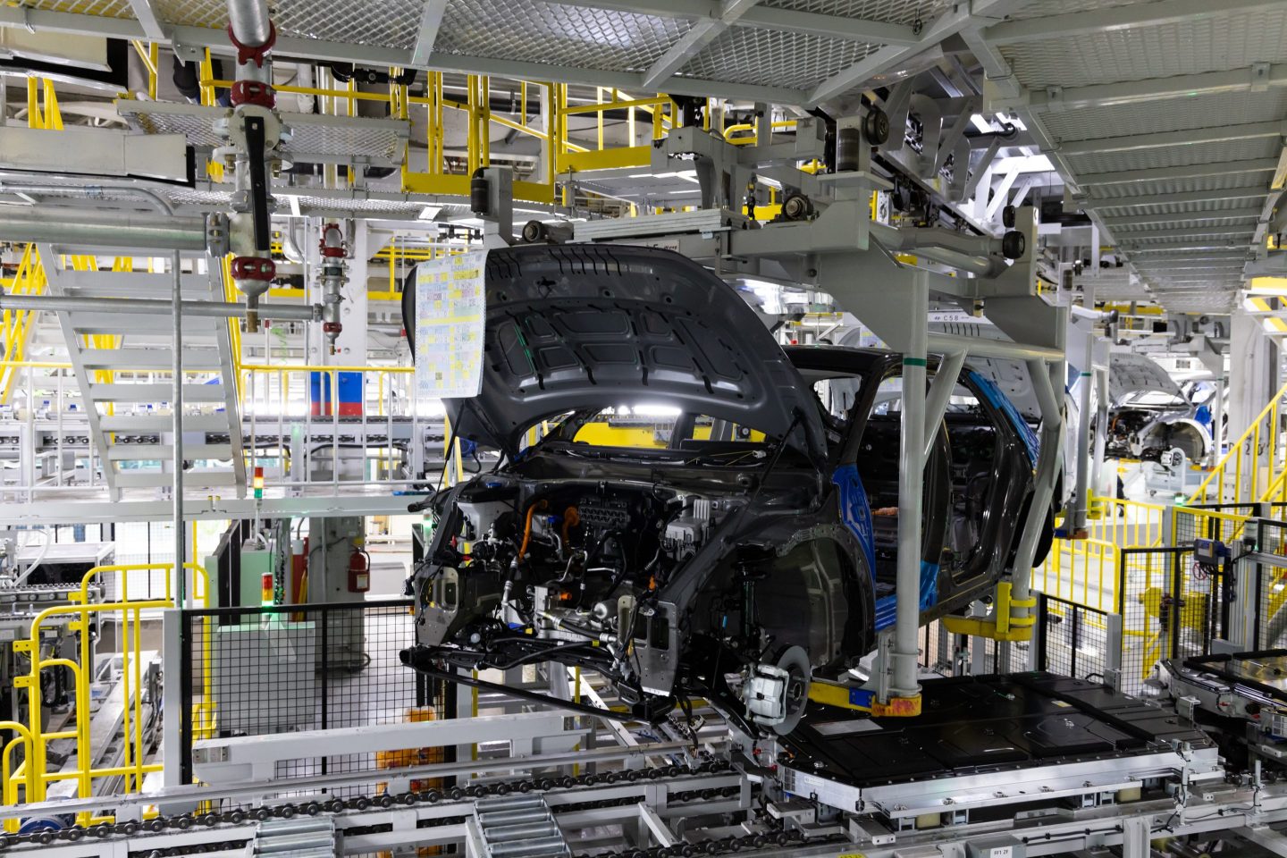 A car being built on the assembly line.