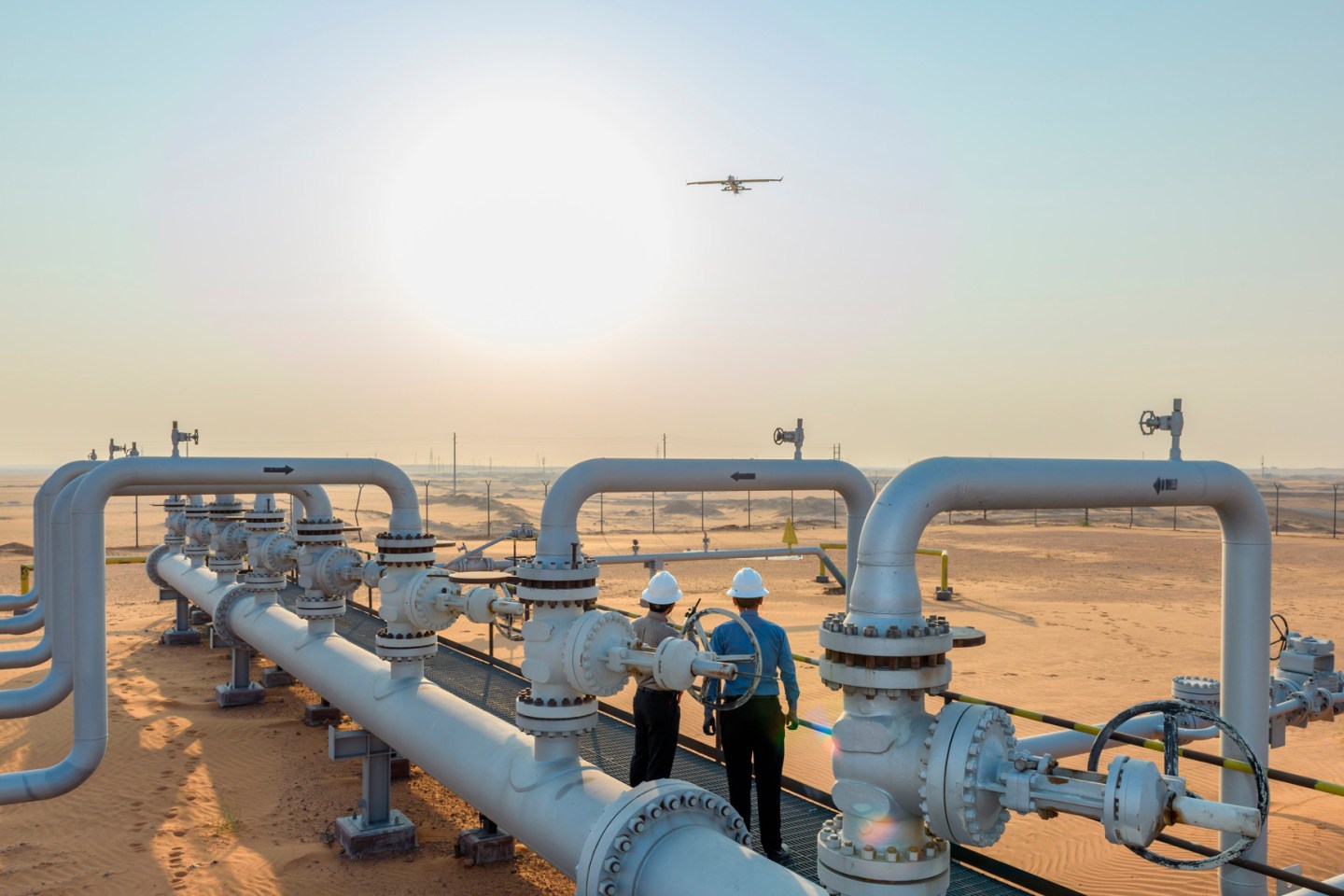 A fixed-wing drone flies over Saudi Aramco's Khurais field.