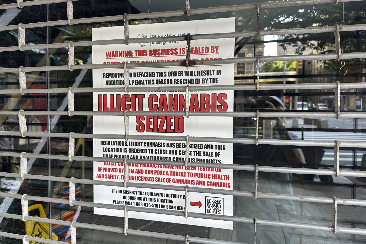 FILE — A notice from the Office of Cannabis Management is posted in the window of a closed shop, on New York&#8217;s Upper West Side, June 21, 2024. (AP Photo/Richard Drew, File)