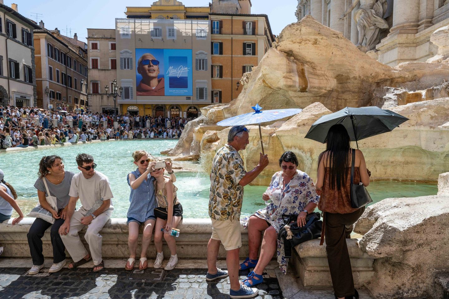 Tourists at the Trevi Fountain in Rome, Italy.