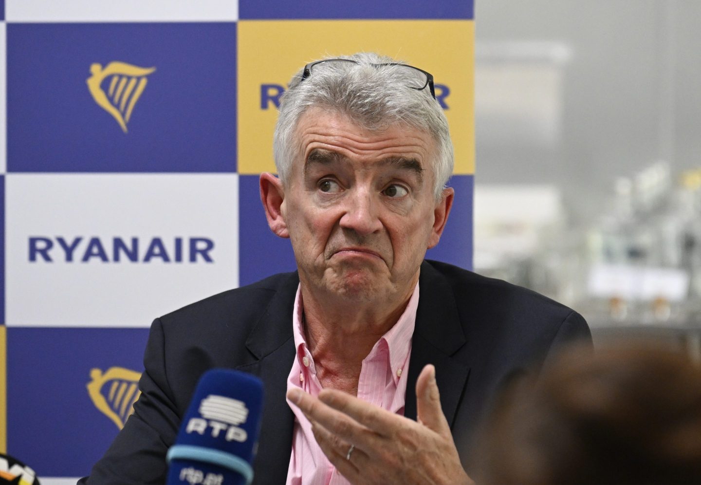 Ryanair Group CEO Michael O'Leary gestures while making a point during a press conference with Eddie Wilson, CEO of Ryanair, and Jason McGuinness, Commercial Director, to talk about the future of the company's operation in the Portuguese market on July 23, 2024 in Lisbon, Portugal. on July 23, 2024 in Lisbon, Portugal. Ryanair appealed today to airports ANA administration to reduce "excessive taxes" in Portuguese airports to make possible to offer competitive costs in order to re establish the growth of the country's economy, employment and Portuguese tourism industry.