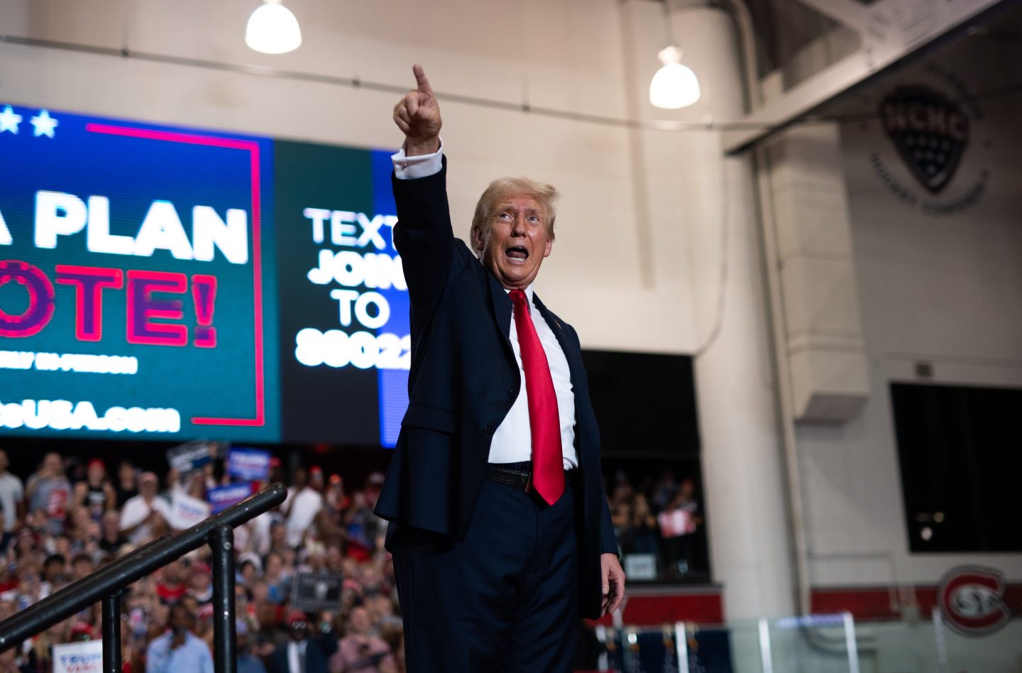 Republican Presidential nominee former President Donald Trump leaves the stage after speaking during a rally.