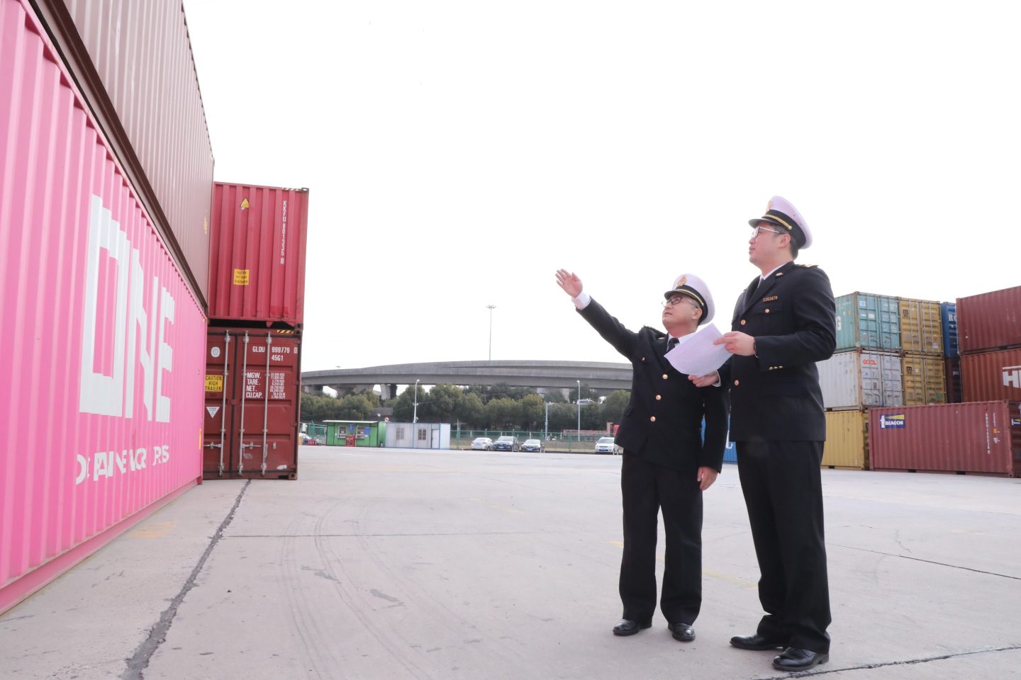 Customs officers are inspecting a batch of import and export containers at a freight yard in Jiangsu Province, China.