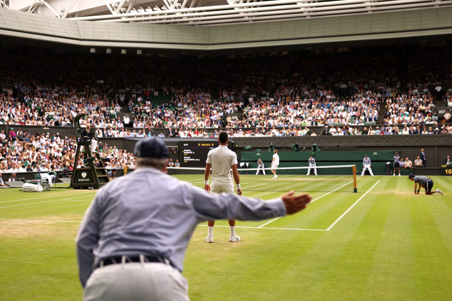 A line judge calls out during the Men's Singles Quarter Final