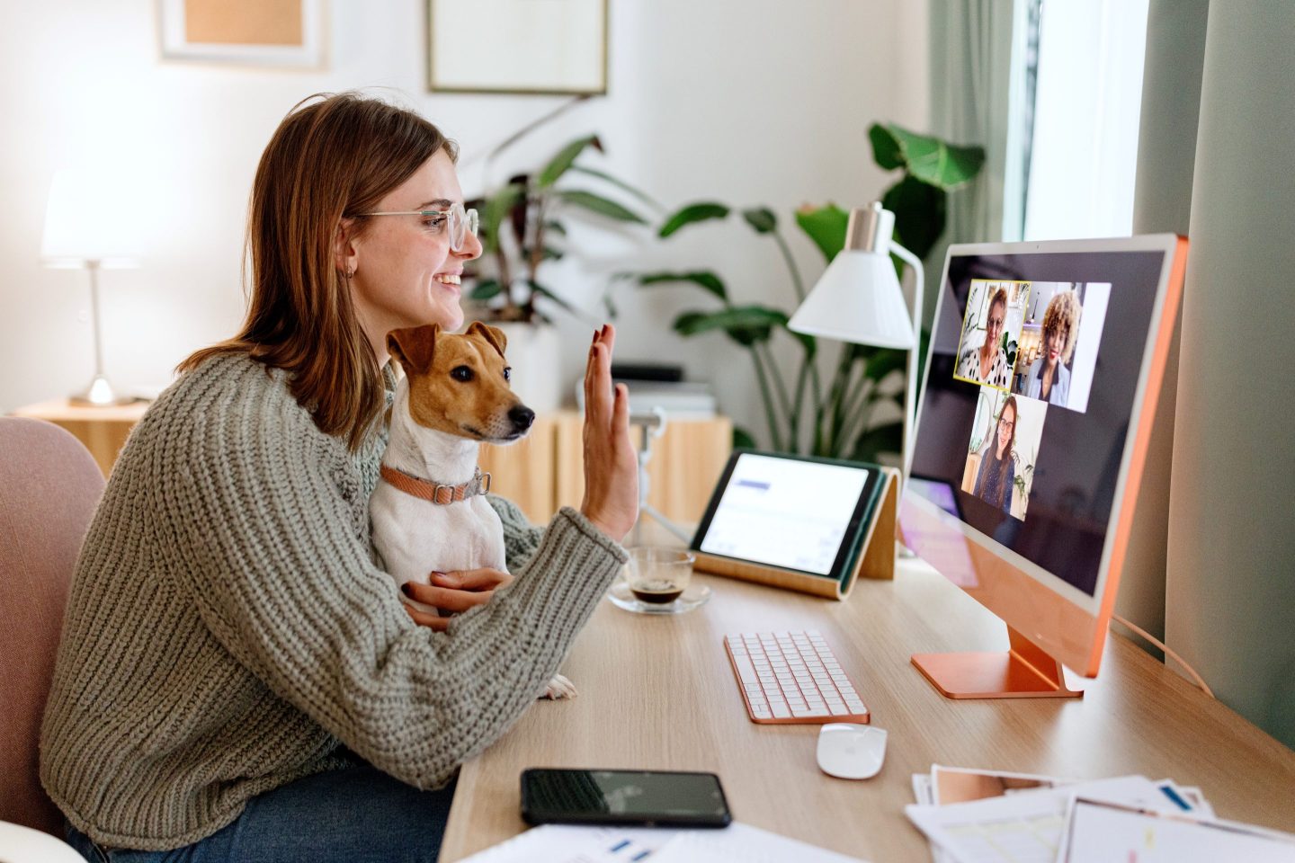 Woman on a hybrid meeting at home