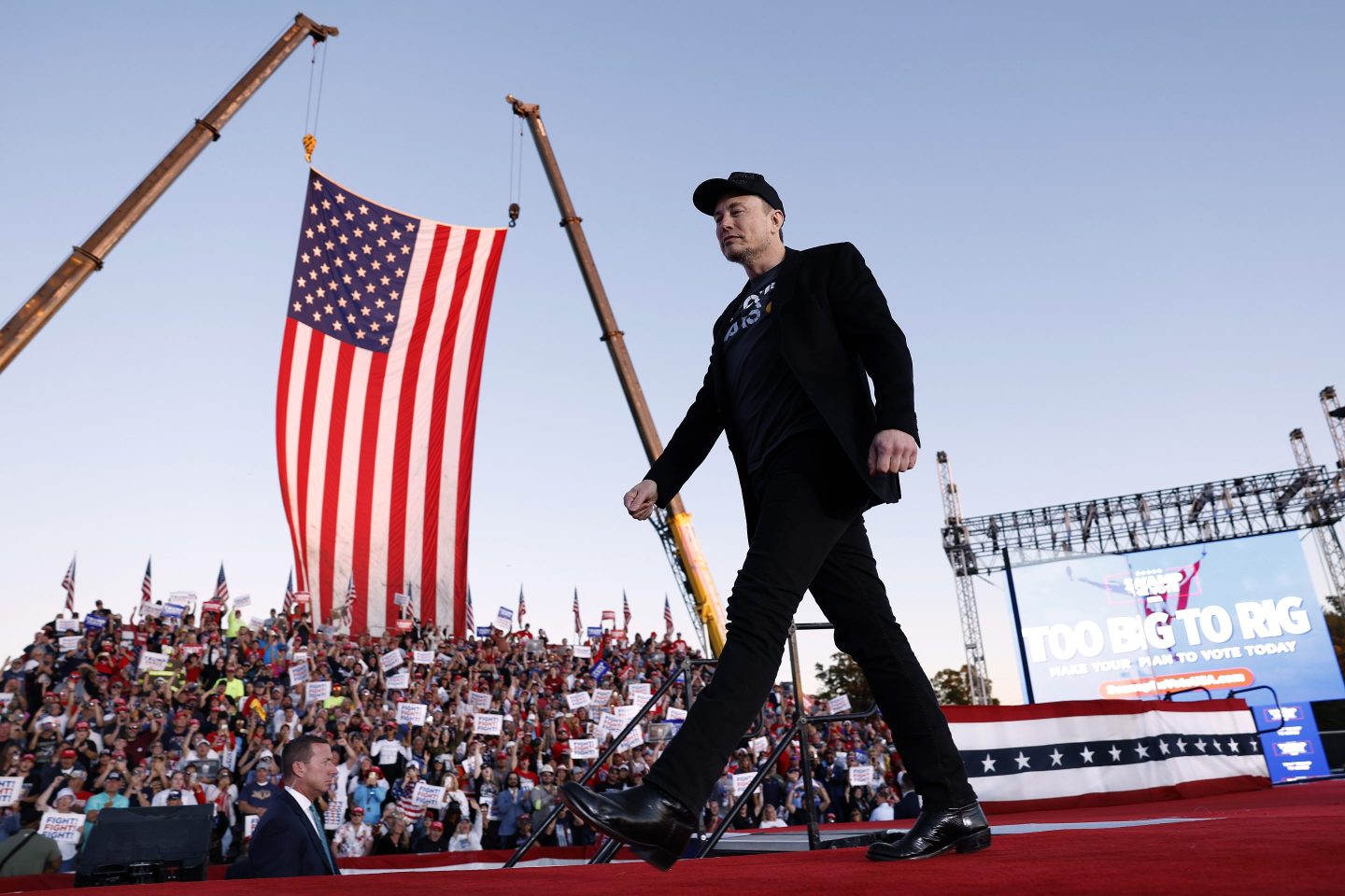 Elon Musk struts on stage at a Trump rally ahead of the presidential election