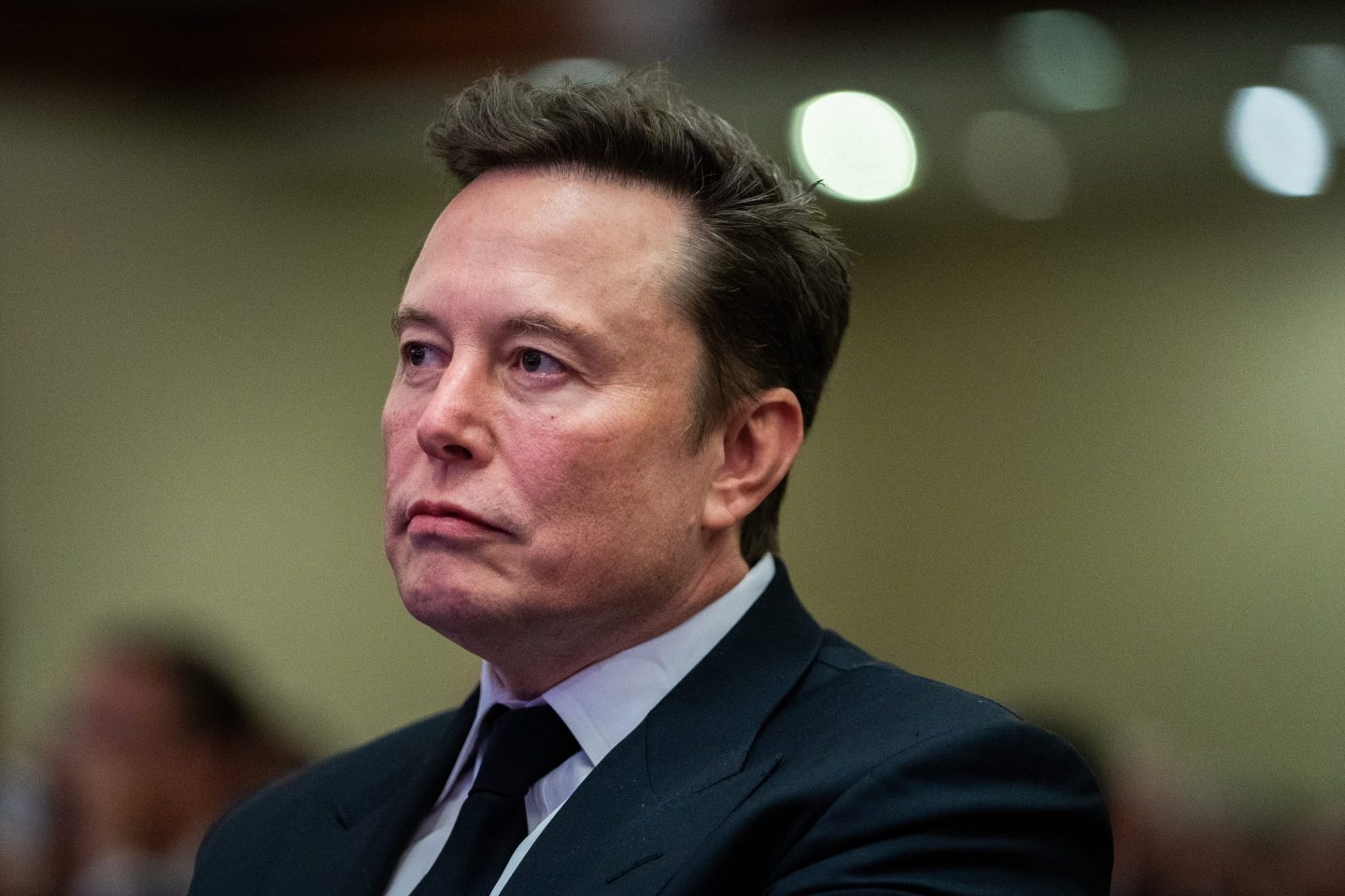 WASHINGTON, DC &#8211; NOVEMBER 13: Elon Musk listens as US President-elect Donald Trump speaks during a House Republicans Conference meeting at the Hyatt Regency on Capitol Hill on November 13, 2024 in Washington, DC. As is tradition with incoming presidents, President-elect Trump is traveling to Washington, DC to meet with U.S. President Joe Biden at the White House as well as Republican members of Congress on Capitol Hill. (Photo by Allison Robbert-Pool/Getty Images)