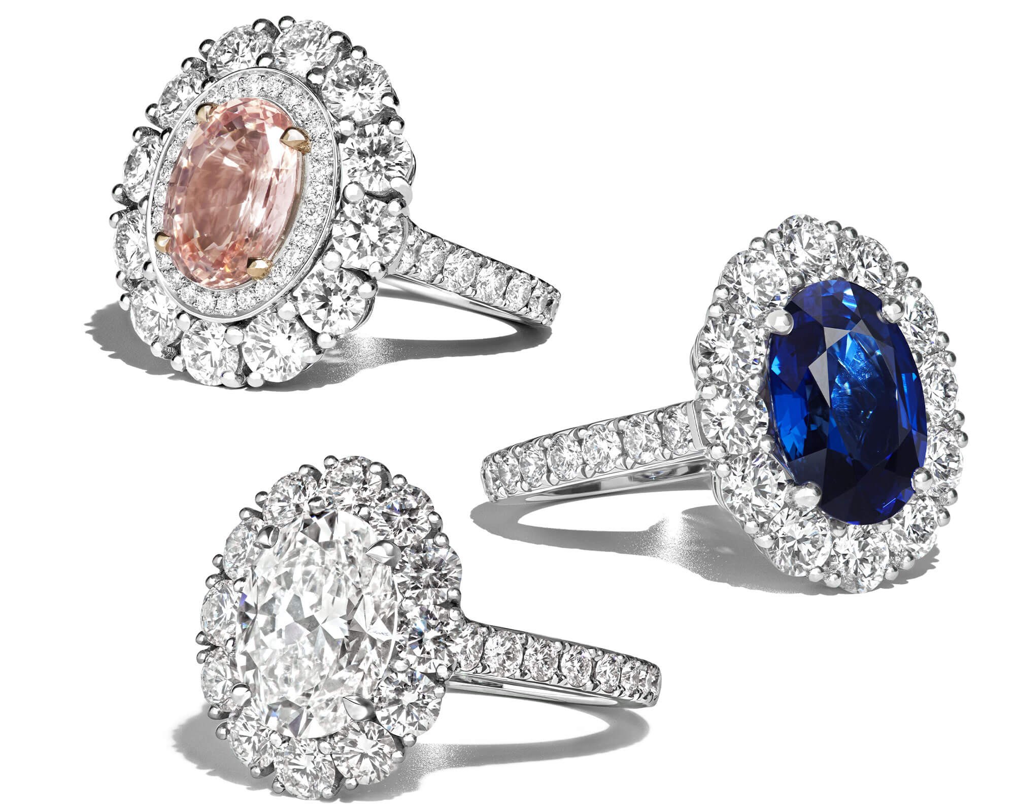 A trio of Garrard gemstone and diamond engagement rings