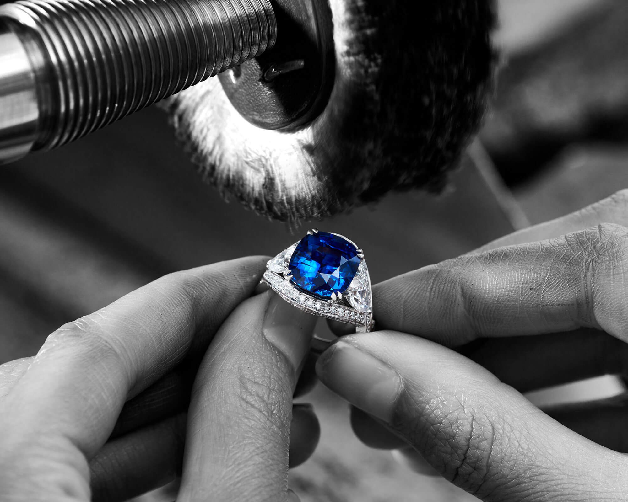 a craftsman repairing a Garrard Jewelled Vault Sapphire and diamond ringin the workshop care