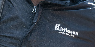 Black jacket with company logo