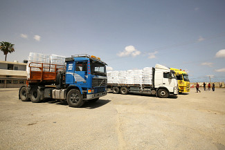 three trucks with human aid on it