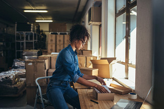 employee preparing a package for delivery