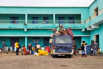Families arrive at a school in Gedaref after fleeing Sinja in southern Sudan.