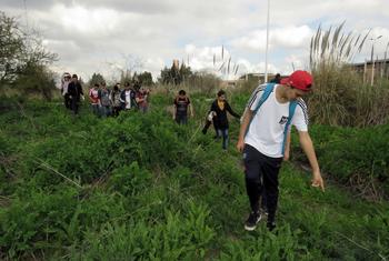 Children explore a nature reserve in Buenos Aires Province.