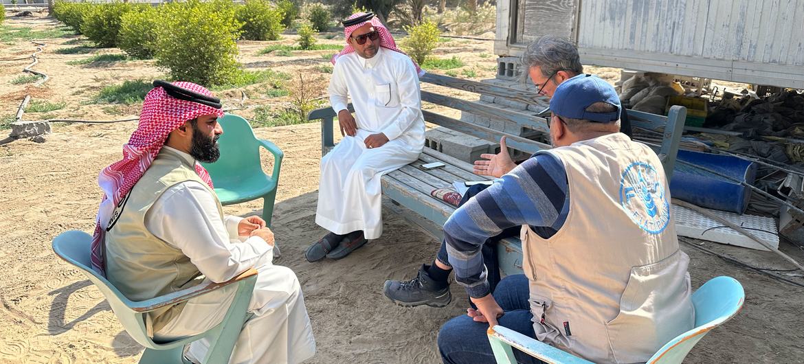 Mohamed Alnwairan (centre) explains how his farm has benefited from smart irrigation techniques.