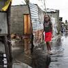 A child stands in rising water after Cyclone Eloise hit Beira, Mozambique. 