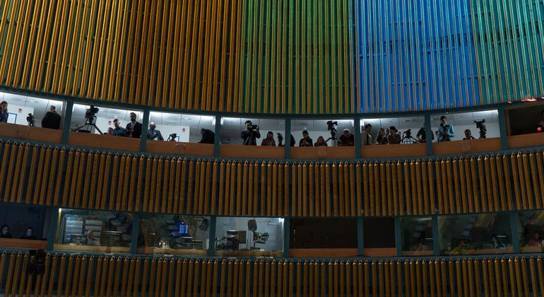 Media representatives document the opening of the SDG Summit.