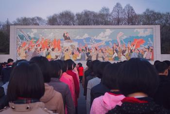 People gather in front of a mural in Pyongyang, in the Democratic People's Republic of Korea. (file)