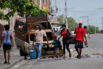 People flee the neighbourhood of Solino in Port-au-Prince following gang attacks there in May 2024.