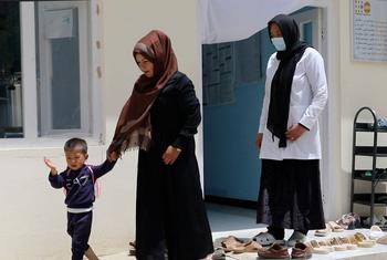 Midwife Mariza Ahmadi (right) assisted Sughra to safely deliver her son, Farhad, at the Ahangaran family health house in the remote Bamyan province, Afghanistan.