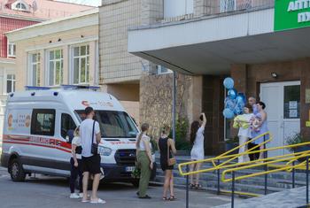 A family celebrates a birth outside the Kyiv Regional Perinatal Centre.