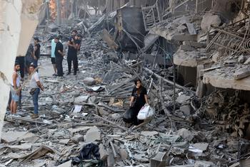 Residents survey the damage in a suburb of southern Beirut left in ruins after being targeted by airstrikes.