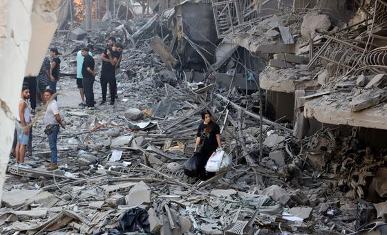 Residents survey the damage in a suburb of southern Beirut left in ruins after being targeted by airstrikes.