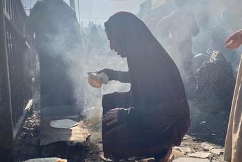 Displaced Palestinians gather near a shelter run by the UN agency for Palestinian refugees (UNRWA) in the Nuseirat area of ​​central Gaza.