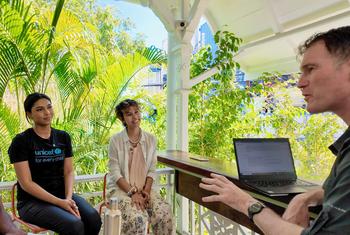 Trinidadian climate activists Joshua Prentice (l), Priyanka Lalla (c) and Zaafia Alexander (r) speak to Conor Lennon from UN News