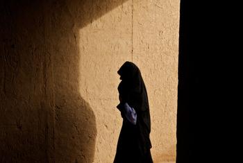 A woman walks through a corridor in a village in Afghanistan. (file)