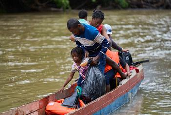 A Haitian family arrive at a temporary reception centre in Panama after crossing the Darién Gap.