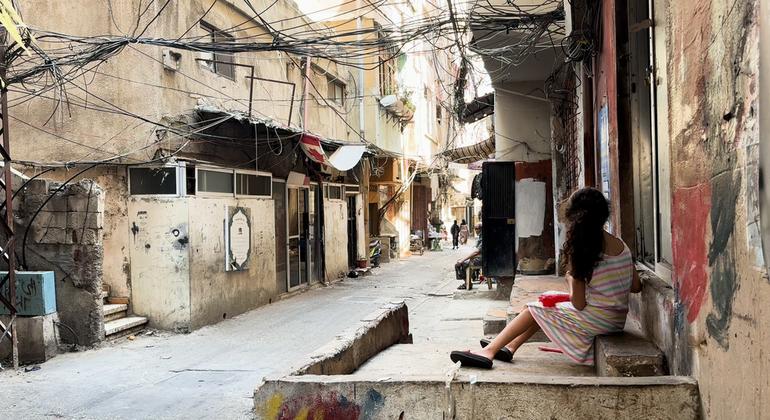 A girl sitting on the steps to her home in the Al Biddawi camp for Palestine refugees in northern Lebanon.