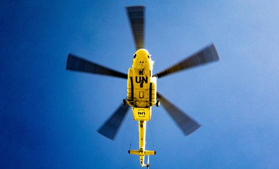 A UN helicopter flies over the village of Ogossagou in central Mali.