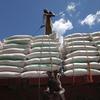 Workmen at Dar Es Salaam harbour loading bags of wheat destined for Central Africa (file)