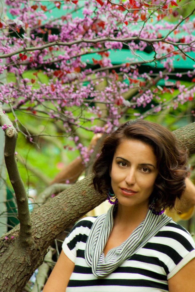 Girl and flowering trees at Bronx Zoo, New york