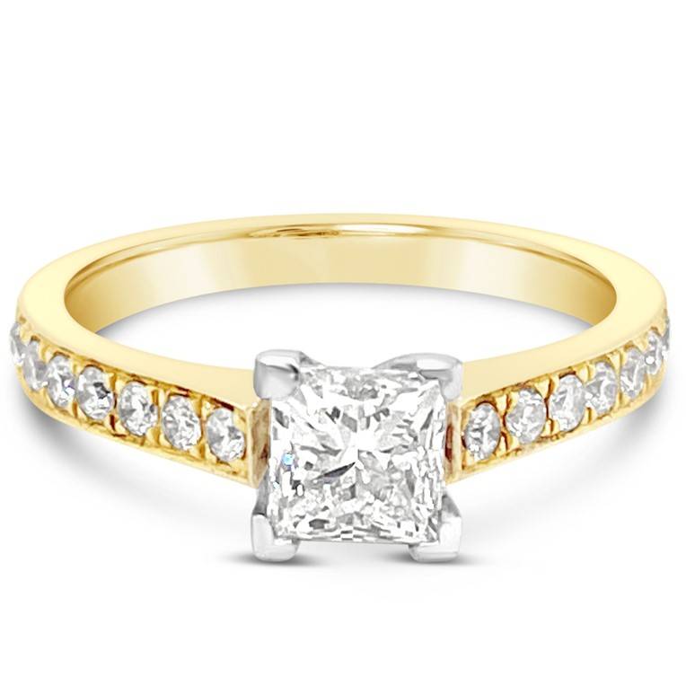 This 18ct yellow and white gold diamond engagement ring is set with one 0.90ct G coloured Si clarity princess cut stone is beautifully accompanied by the round brilliant diamonds equaling a total diamond weight of 0.14ct.