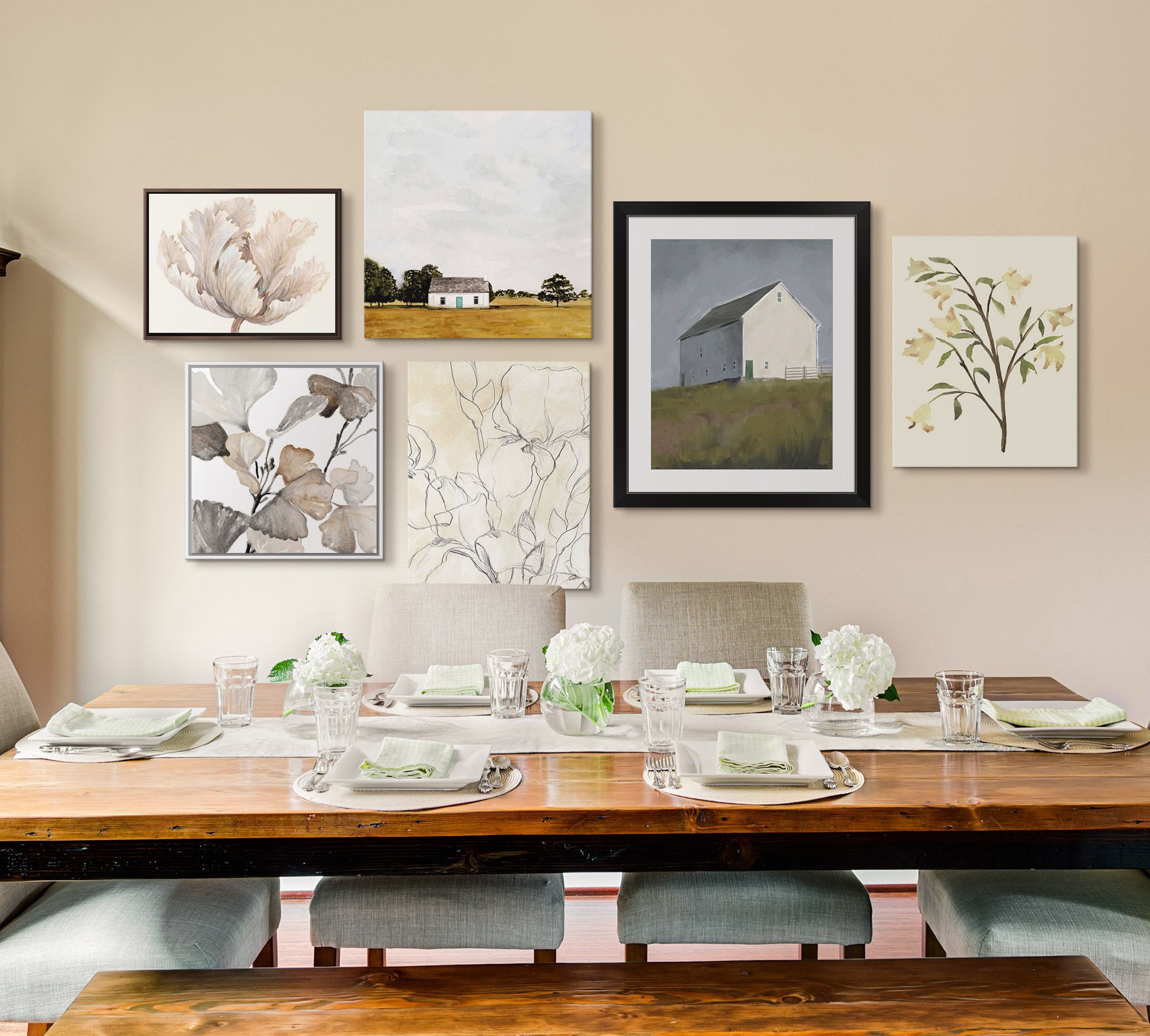 Farmhouse styled gallery wall using framed prints and canvas art in a dining room