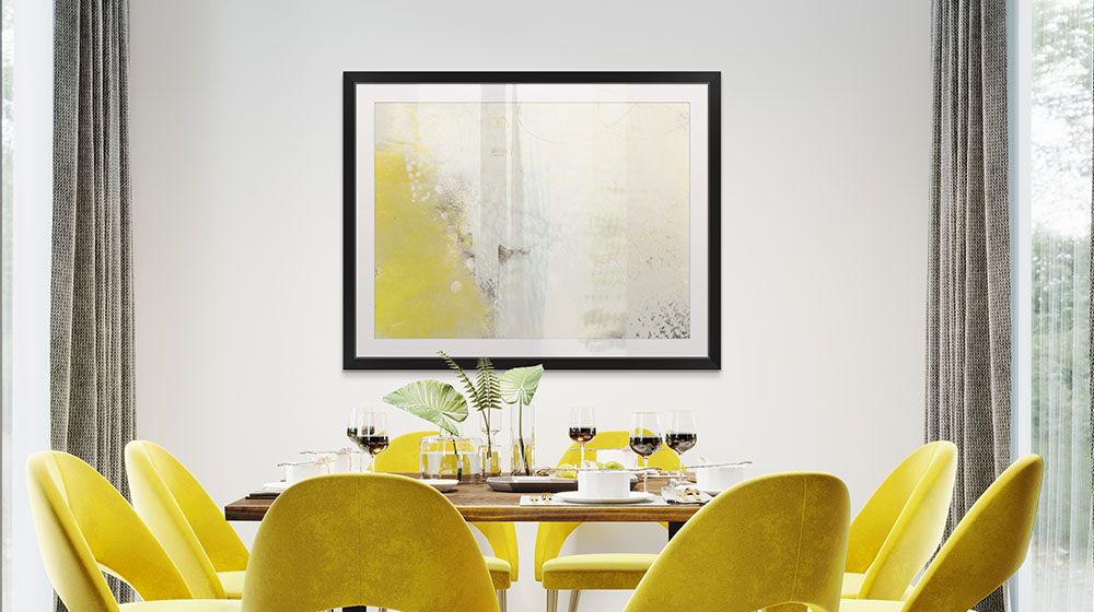 Yellow Lux I by Sue Jachimiec over a modern dinning set with yellow chairs