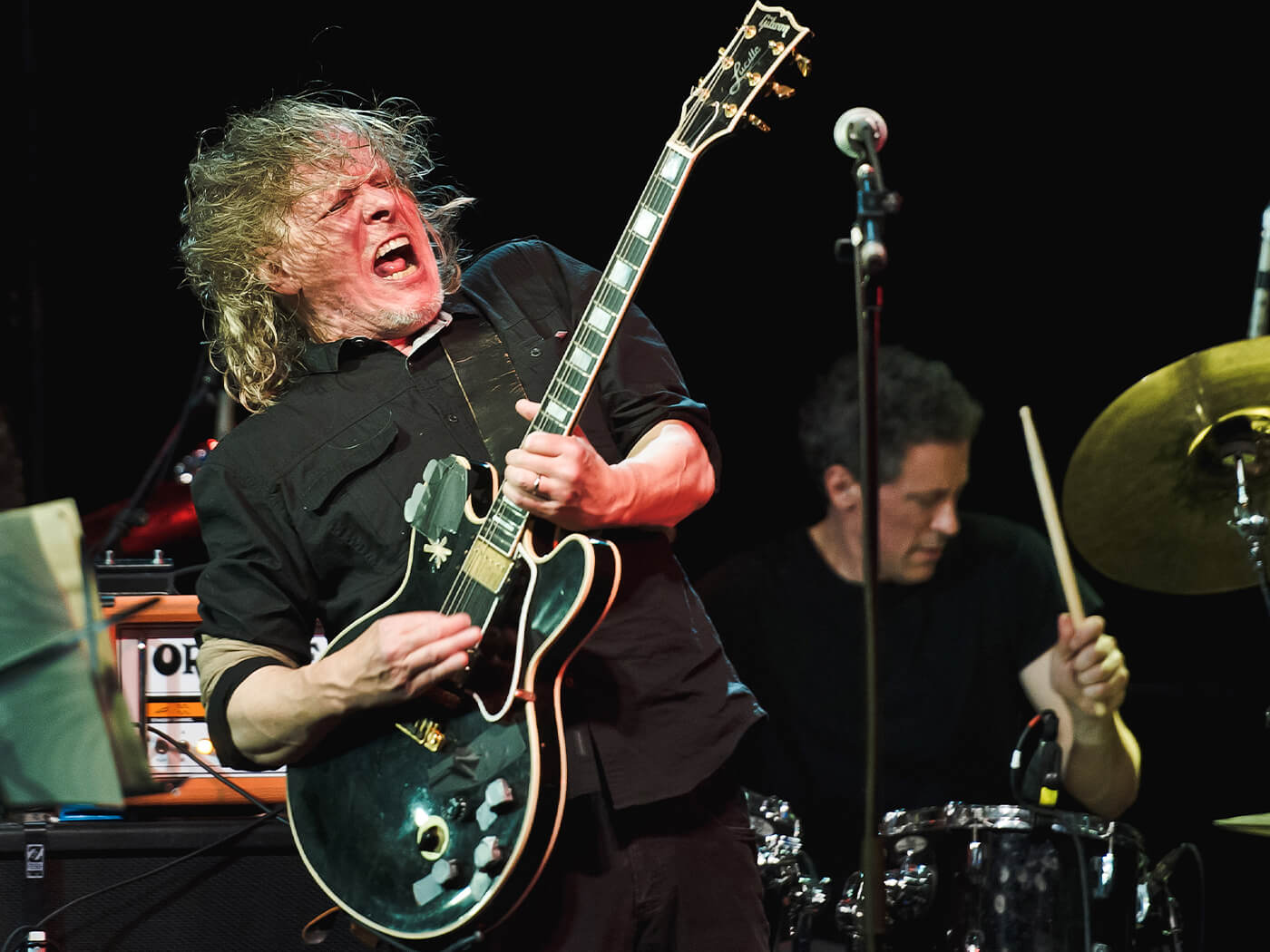 Michael Gira onstage with Swans