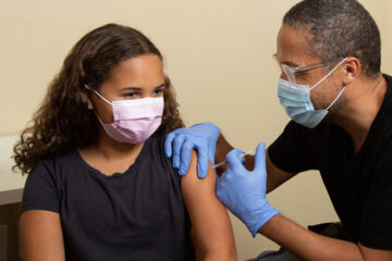 photo of kid getting the COVID-19 vaccine