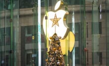 Christmas tree with star on top in front of Apple logo in China