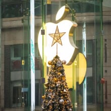 Christmas tree with star on top in front of Apple logo in China