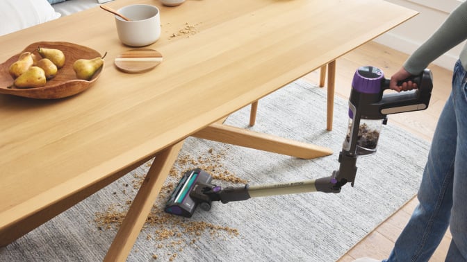 shark powerdetect cordless vacuum bending in middle to reach under table