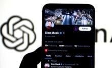 X page of Elon Musk seen displayed on a smartphone with an Open AI Logo in the background