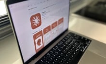 a laptop showing the Claude app in the App Store