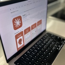 a laptop showing the Claude app in the App Store