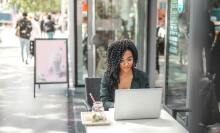 Girl using laptop at desk