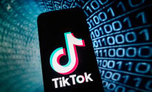 TikTok logo in front of binary code