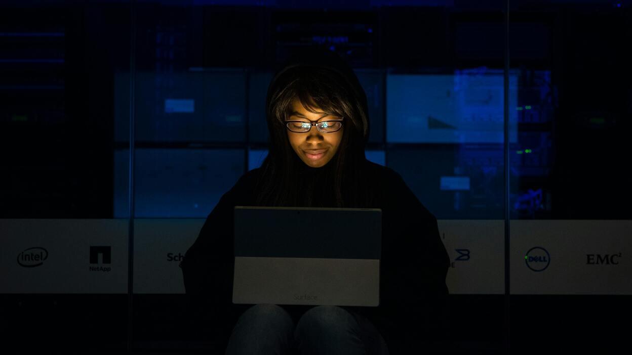 Girl looking at laptop